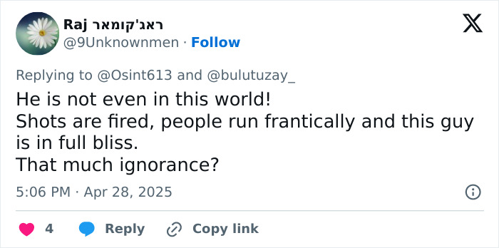 Tweet expressing shock at a tourist smiling and in bliss while a mass tragedy unfolds with shots fired and people running. Tweet expressing shock at a tourist smiling and in bliss while a mass tragedy unfolds with shots fired and people running.