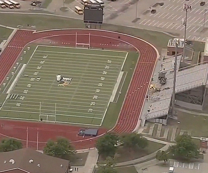 Aerial view of a school football stadium and track, related to a heartbreaking story of a 17-year-old's final moments. Aerial view of a school football stadium and track, related to a heartbreaking story of a 17-year-old's final moments.