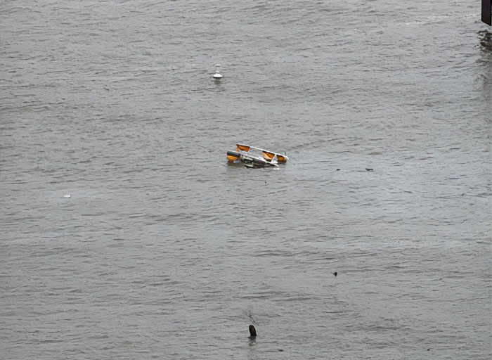 Debris of NYC helicopter crash floating in water. Debris of NYC helicopter crash floating in water.