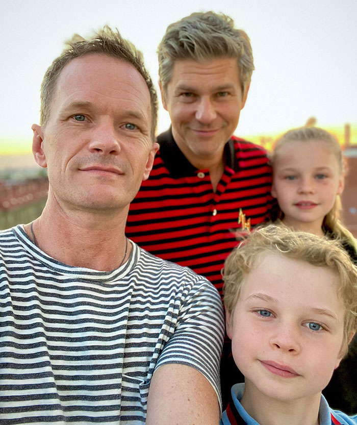 Family vacation in Fiji with kids and two adults posing for a selfie at sunset. Family vacation in Fiji with kids and two adults posing for a selfie at sunset.