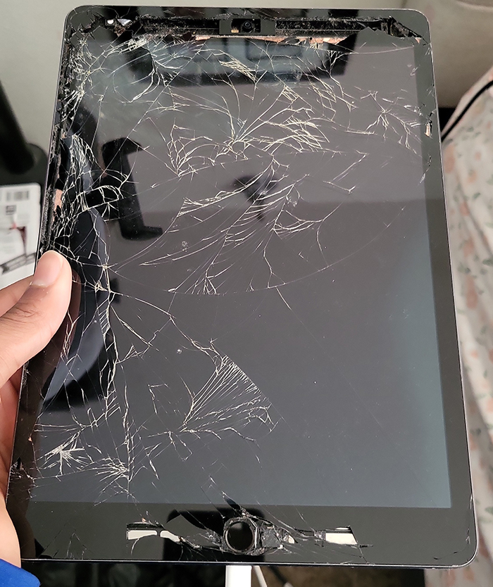 Shattered iPad screen after child ran amok at bowling alley. Shattered iPad screen after child ran amok at bowling alley.