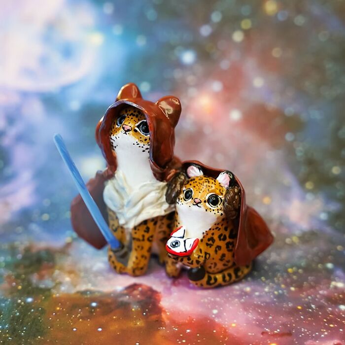 Pocket-sized animal figurines by Vallavica, depicting cute creatures in hooded robes against a starry background.