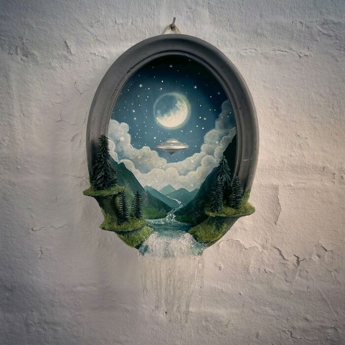 Alien mystery diorama by Caroline Dewison, featuring a UFO, mountains, and a moonlit night sky.
