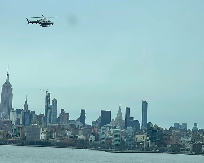 Helicopter over Hudson River with New York City skyline in background. Helicopter over Hudson River with New York City skyline in background.