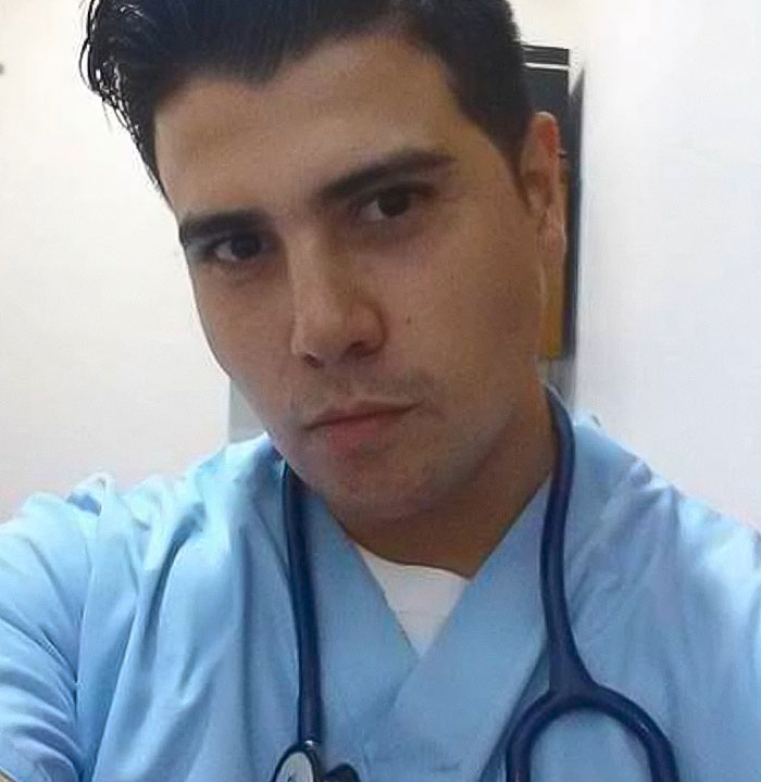 Young man in medical attire with stethoscope, posing as plastic surgeon. Young man in medical attire with stethoscope, posing as plastic surgeon.