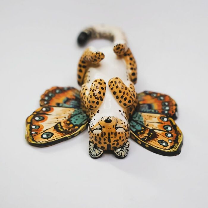 Pocket-sized animal figurine by Vallavica, featuring a whimsical leopard-butterfly design.