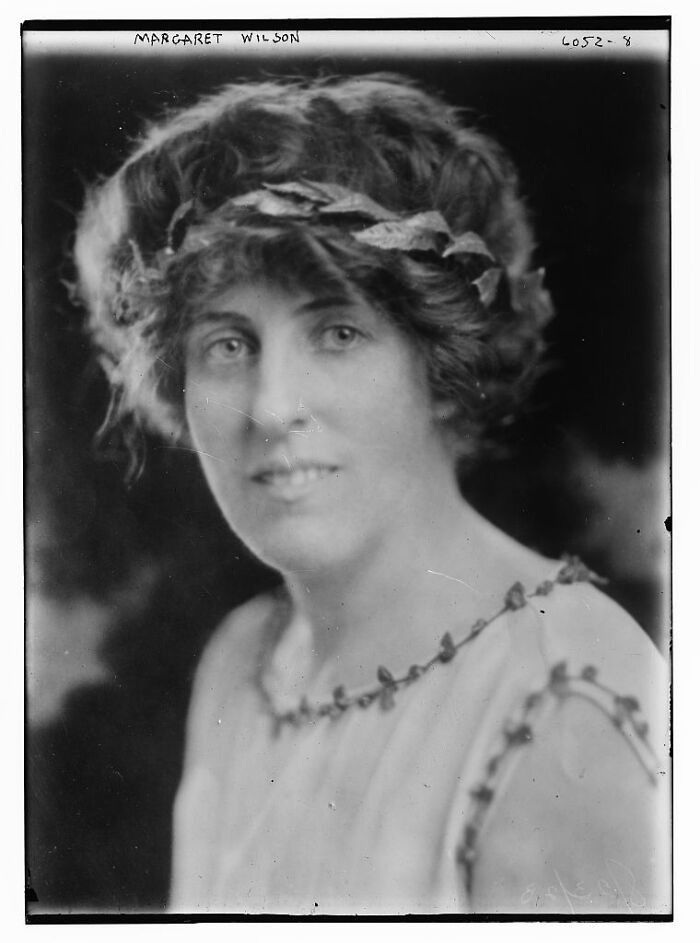 Black and white rare photograph of a woman from early 20th century rescued from glass negatives archive.