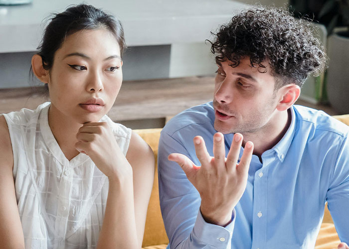 Couple discussing concerns about guests' luggage. Couple discussing concerns about guests' luggage.