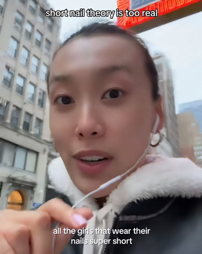 Gen Z woman discusses short-nail theory, sparking debate on patriarchy. Gen Z woman discusses short-nail theory, sparking debate on patriarchy.