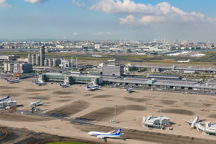 Aerial view of one of the 2024 busiest airports with multiple planes on the runway. Aerial view of one of the 2024 busiest airports with multiple planes on the runway.