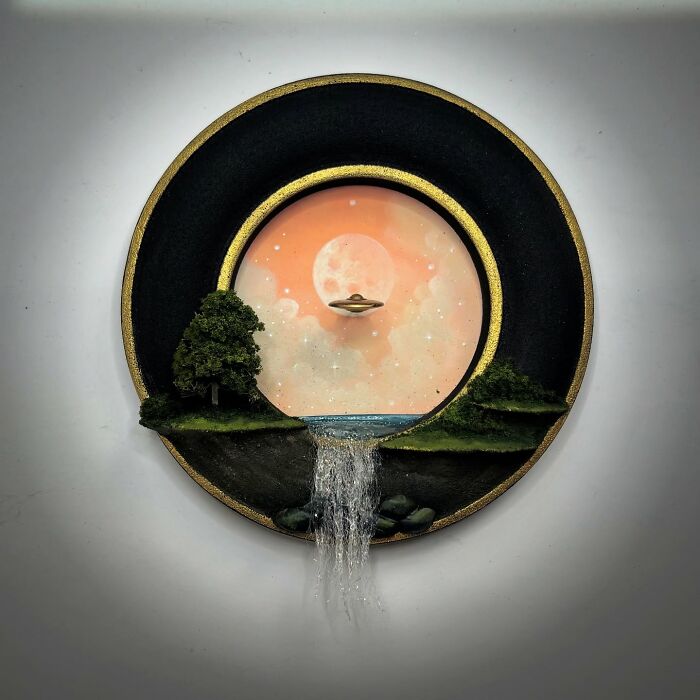 Alien diorama with UFO, featuring a waterfall under a starry sky within a circular frame.