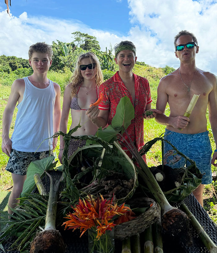 Family enjoying outdoor scenery in Fiji with tropical plants, smiling under a bright sky, embodying a "carbon copy" vibe. Family enjoying outdoor scenery in Fiji with tropical plants, smiling under a bright sky, embodying a "carbon copy" vibe.