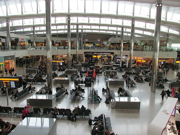 Bustling scene inside one of 2024's top 10 busiest airports, featuring travelers seated and moving through the terminal. Bustling scene inside one of 2024's top 10 busiest airports, featuring travelers seated and moving through the terminal.