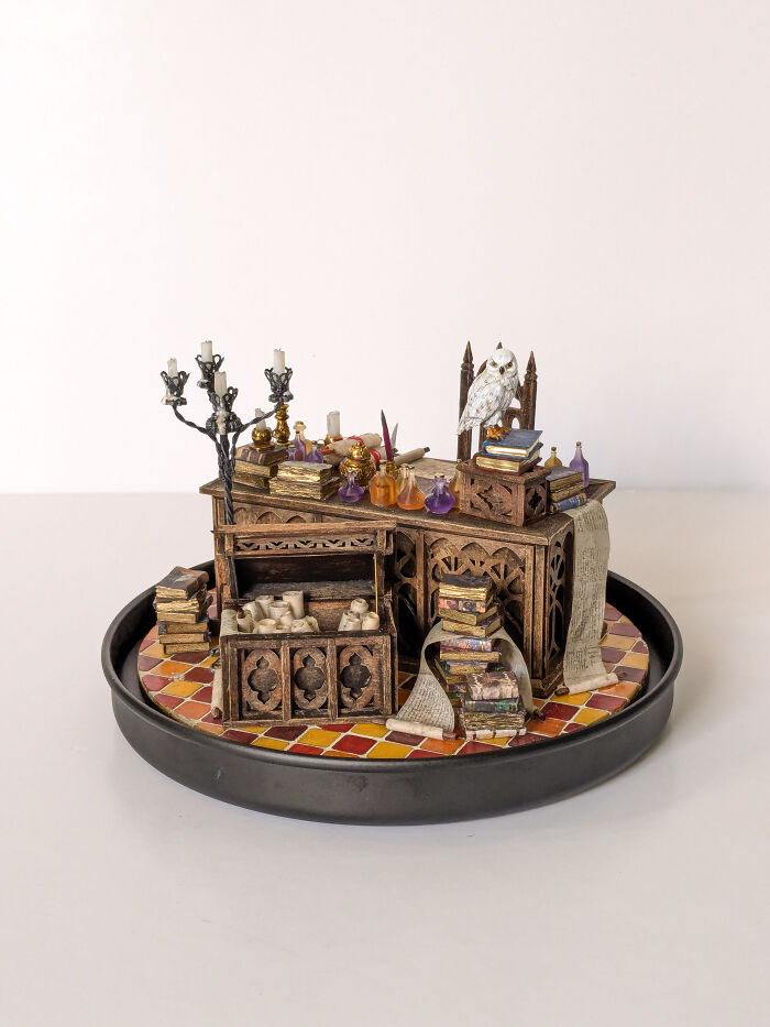 Miniatures by Tamar Cohen featuring a detailed tiny wizard's study with books, scrolls, and an owl.