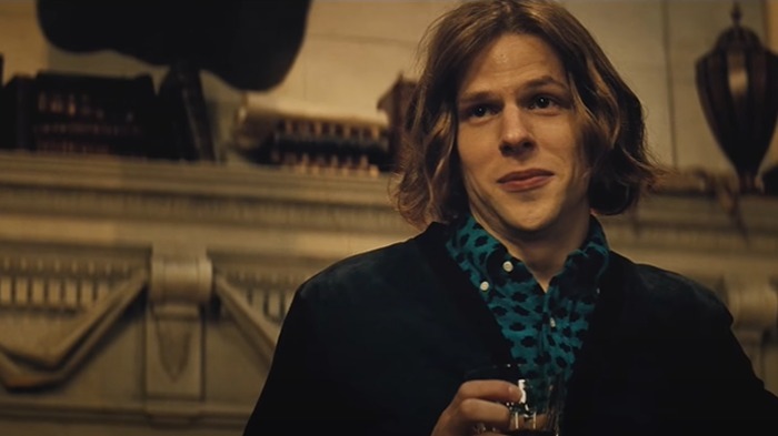 A person with long hair and a patterned shirt holds a drink, illustrating casting mistakes Hollywood regrets.