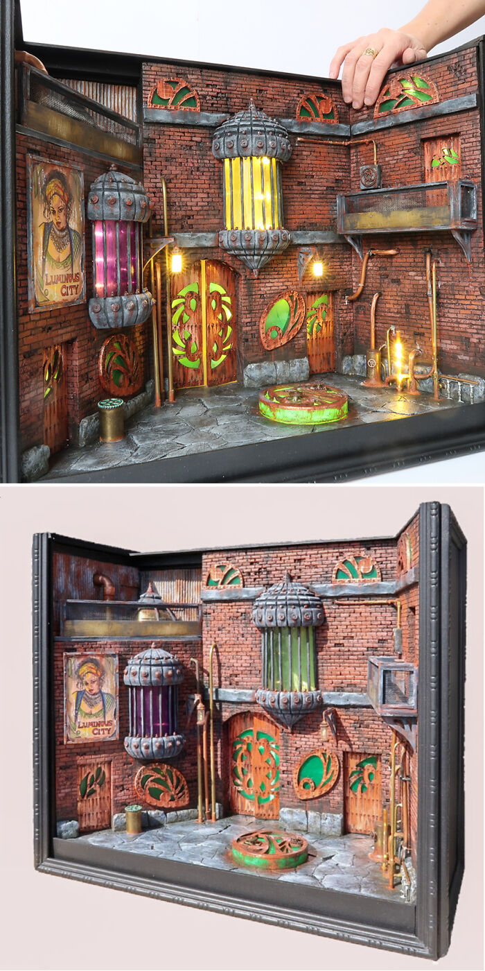 Miniature urban scene with vibrant details by Tamar Cohen, depicting a tiny world with intricate brick buildings and bright lights.