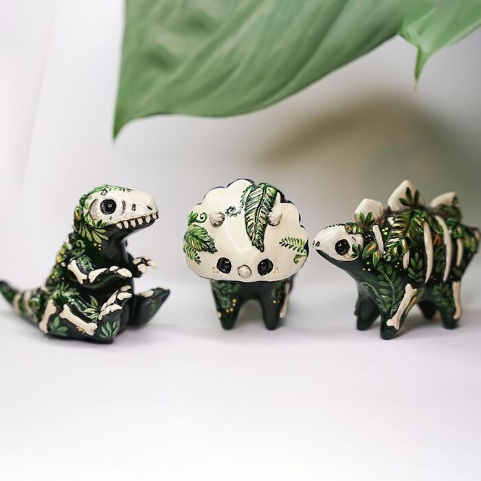 Pocket-sized animal figurines by Vallavica, featuring intricate plant designs on small, green, and white creatures.