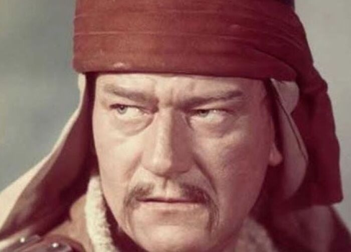 Actor in a period costume with a red headscarf, related to casting mistakes in Hollywood films.