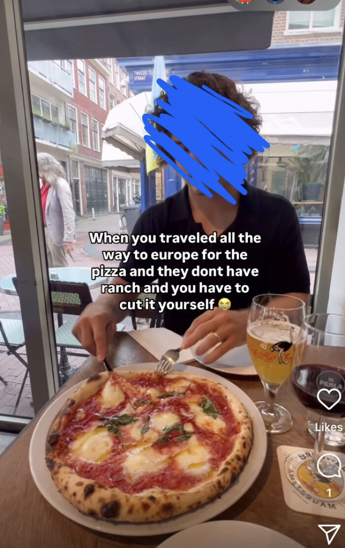 Person trying to cut pizza in a European cafe without ranch dressing, highlighting self-awareness issues.
