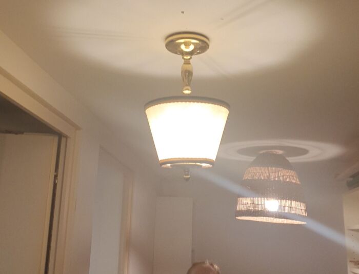 Failed repair attempt: mismatched ceiling lamps, highlighting a DIY error.