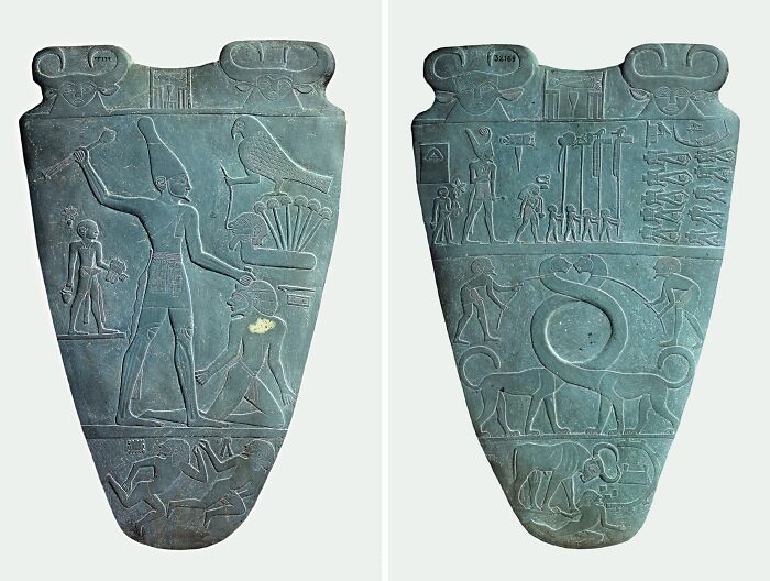 Ancient Egyptian carved stone artifact with hieroglyphs, depicting scenes of historical significance.