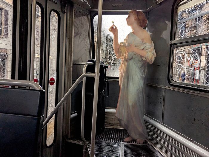 Classical figure in a modern bus interior by Alexey Kondakov, blending art and urban life.