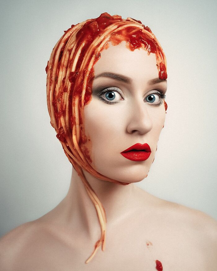 Artist's surreal self-portrait with spaghetti and sauce headpiece, showcasing creative Photoshop skills.