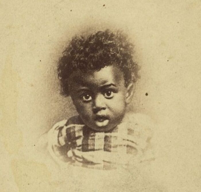 Portrait of a young African American child showcasing the strength and resilience of African Americans over a century ago