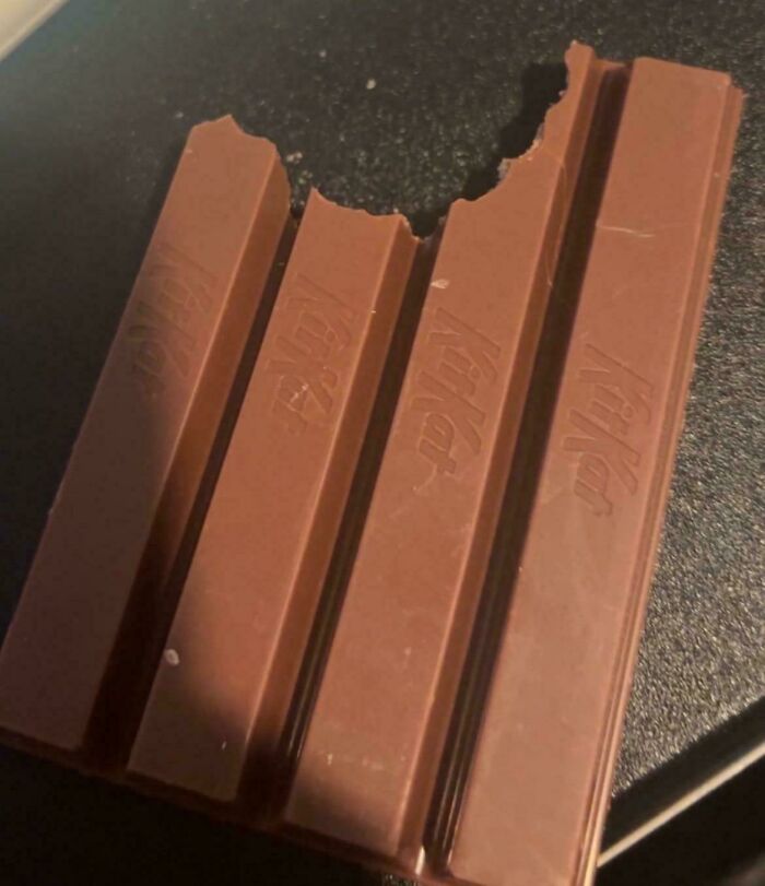 Four Kit Kat bars with uneven bite marks, an unremarkable photo that is oddly entertaining to look at.