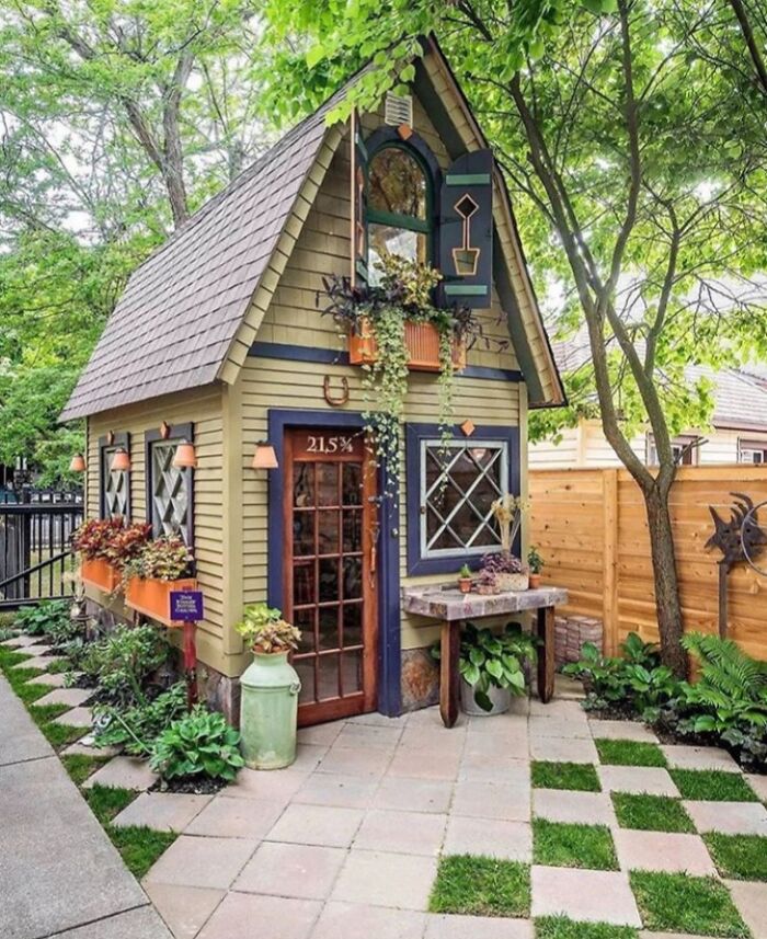 Charming tiny home with garden features and unique design inspiring life off the grid in a peaceful natural setting.