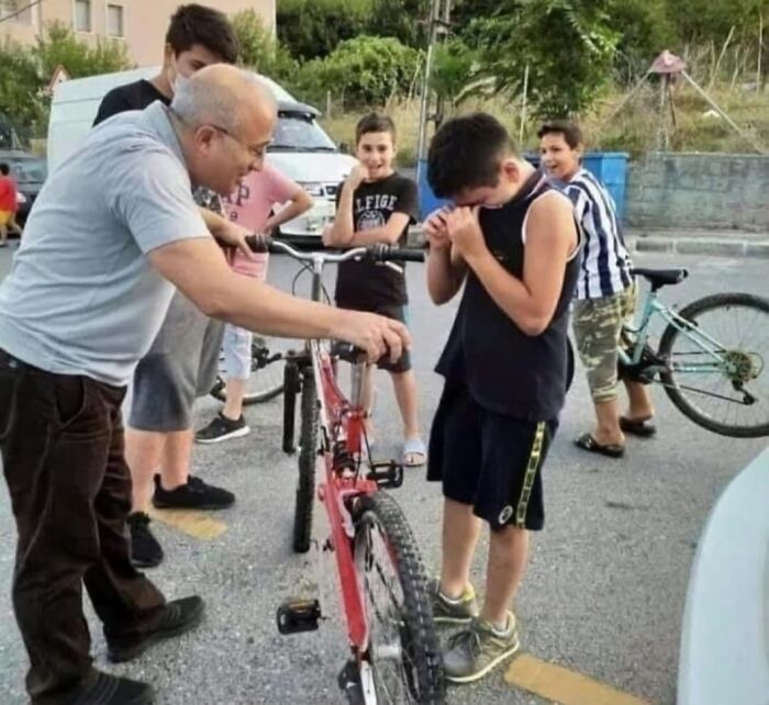 Man surprises boy with new bike as a heartwarming act, showcasing forbidden stories of kindness.