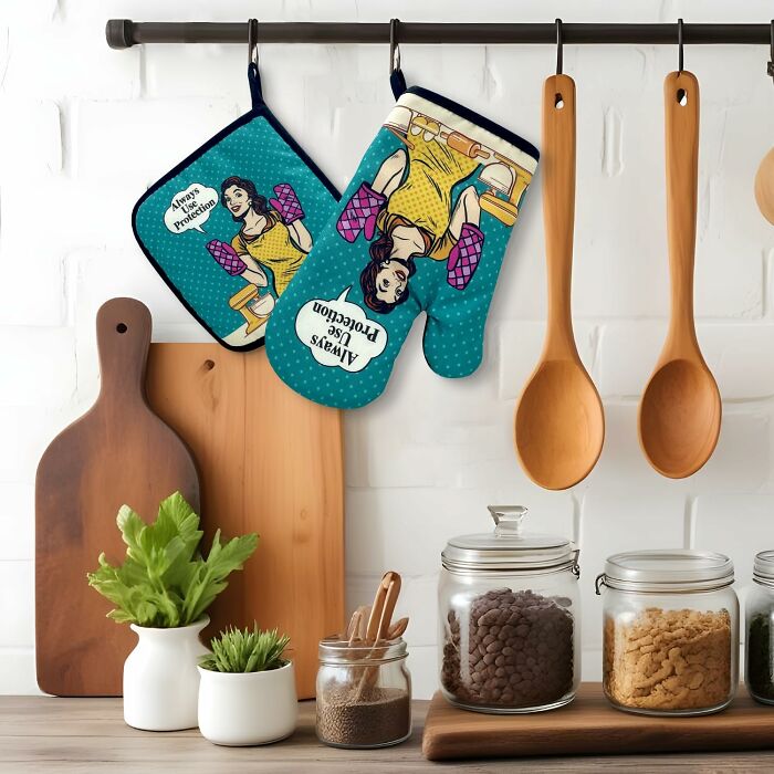 Kitchen with wooden utensils, cutting boards, and funny Mother's Day gifts oven mitt and pot holder displayed.