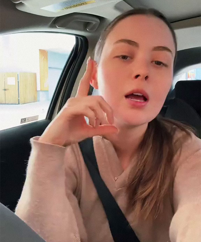 Small business owner in a car discussing how new tariffs could impact her company. Small business owner in a car discussing how new tariffs could impact her company.