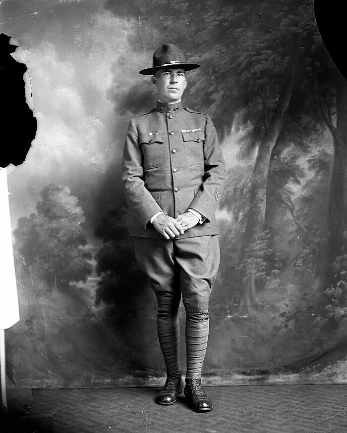 Black and white photograph of a soldier in vintage uniform, part of rare photographs rescued from glass negatives collection.
