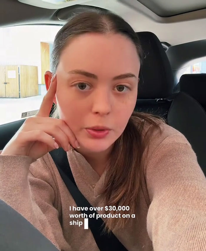 A small business owner discusses the impact of tariffs on her company from inside a car. A small business owner discusses the impact of tariffs on her company from inside a car.