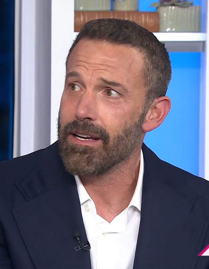 Man speaking in an interview, wearing a suit, discussing his approach to parenting and children's work ethic. Man speaking in an interview, wearing a suit, discussing his approach to parenting and children's work ethic.