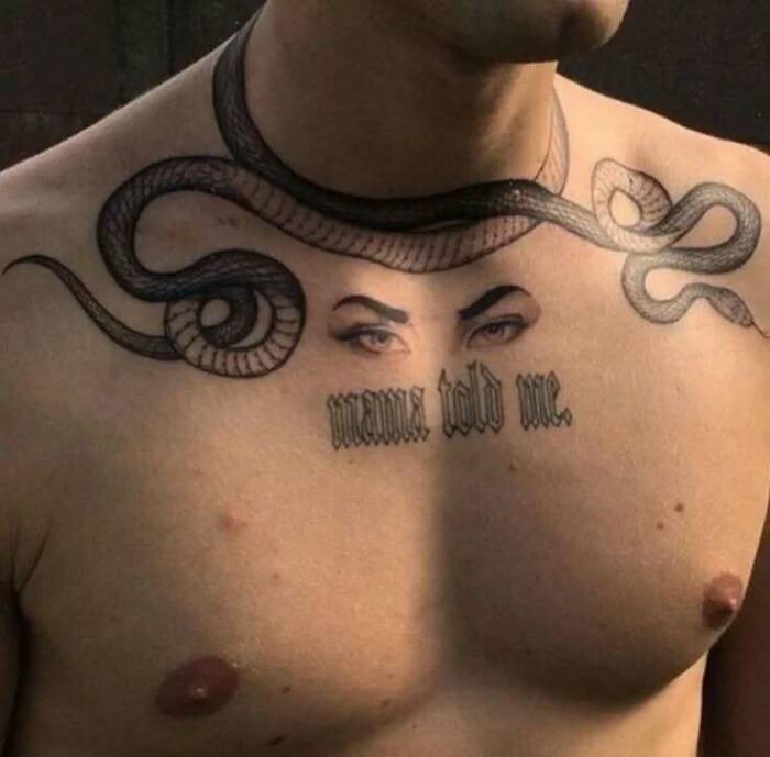 Chest tattoo with snake, eyes, and "mama told me" text from Body Art Museum.