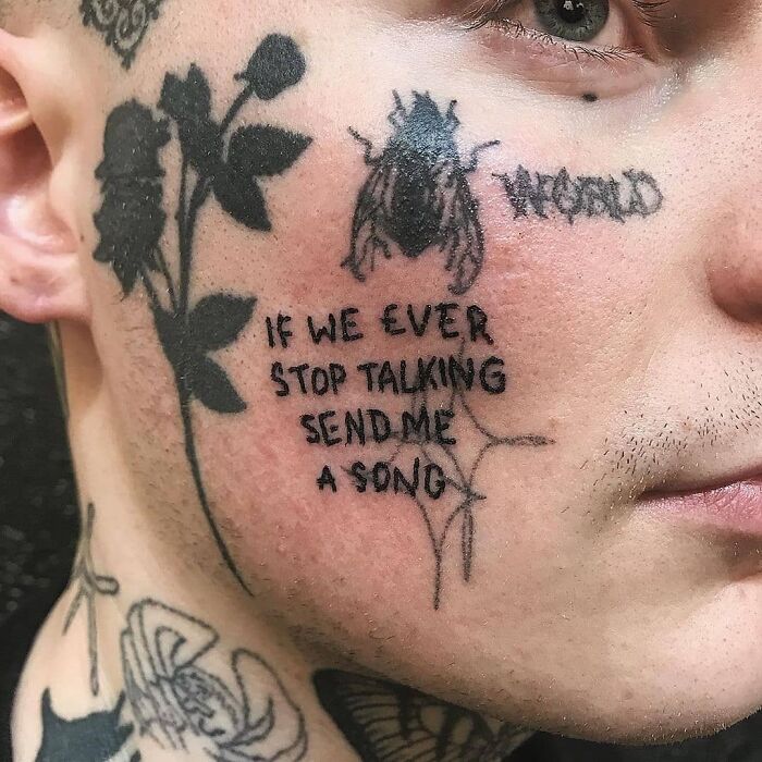 Face tattoos with text and insect, showcasing hilariously bad tattoos.