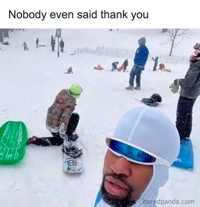 Man in snow gear and sunglasses at a snowy park, capturing a funny moment for best posts.