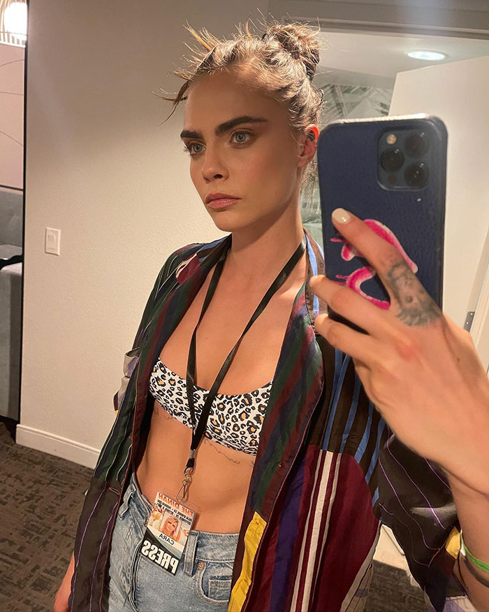 Model holding a phone, wearing a colorful shirt and leopard print top, showcasing transformation praised in 2025. Model holding a phone, wearing a colorful shirt and leopard print top, showcasing transformation praised in 2025.