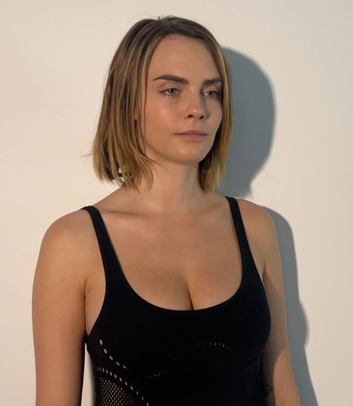 Woman with short hair in a black top, symbolizing dramatic transformation and sobriety. Woman with short hair in a black top, symbolizing dramatic transformation and sobriety.