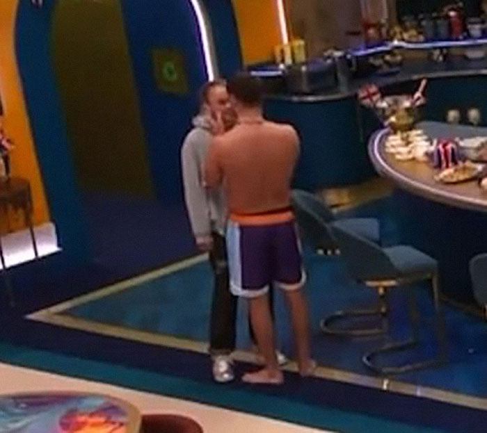 Two people in an intimate moment on Big Brother set. Two people in an intimate moment on Big Brother set.