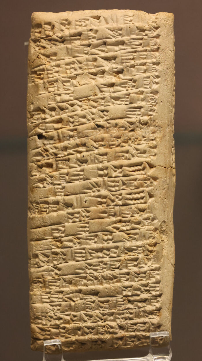 Ancient clay tablet displaying one of the world's oldest written texts, featuring cuneiform script.