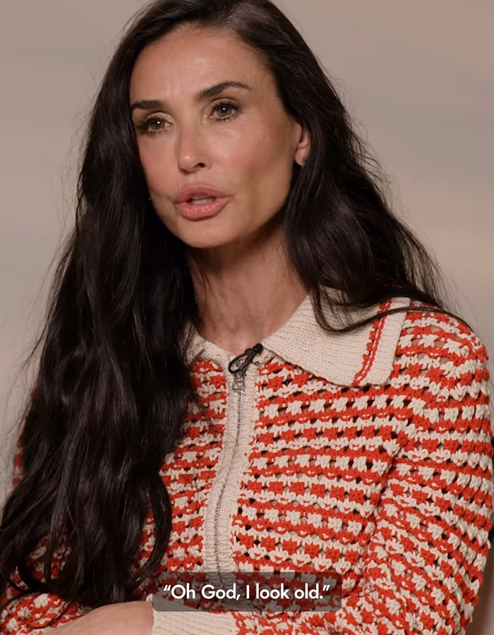 Woman with long dark hair and red patterned sweater speaks about beauty standards. Woman with long dark hair and red patterned sweater speaks about beauty standards.