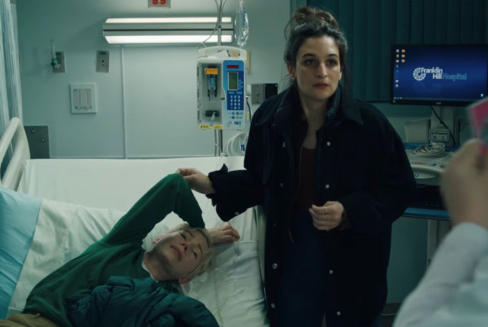 A woman in a hospital room standing beside a patient in bed, conveying a poignant moment. A woman in a hospital room standing beside a patient in bed, conveying a poignant moment.