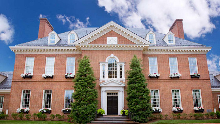 Front view of the Pennsylvania Governor's Mansion, brick facade with white trim and lush greenery. Front view of the Pennsylvania Governor's Mansion, brick facade with white trim and lush greenery.