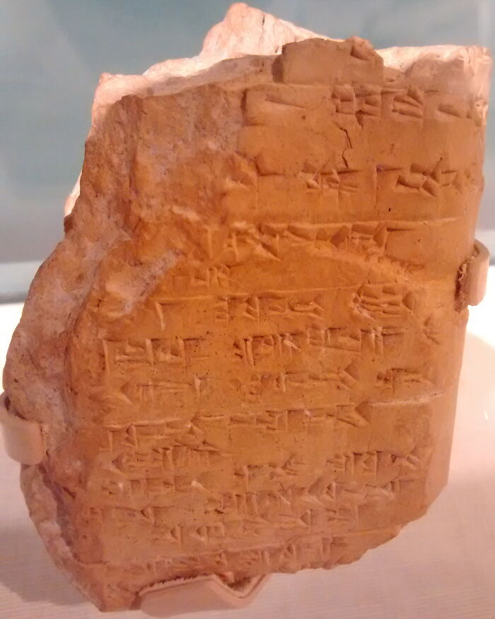 Ancient script on a clay tablet, showcasing one of the world's oldest written texts.