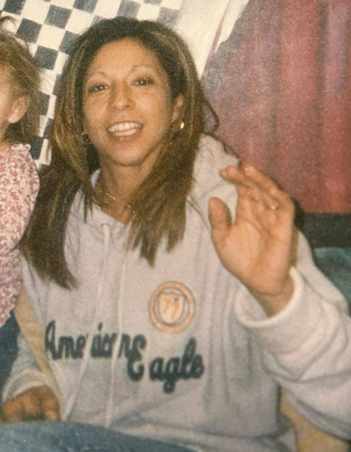 Woman smiling and waving in casual setting, related to New England serial assassination case. Woman smiling and waving in casual setting, related to New England serial assassination case.