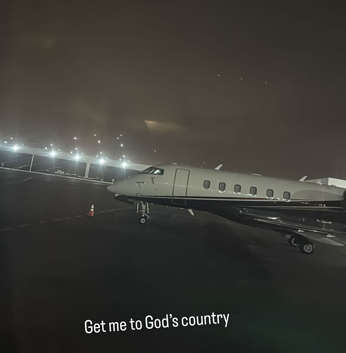 Private jet at night on tarmac, captioned "Get me to God’s country," hinting at a petulant move. Private jet at night on tarmac, captioned "Get me to God’s country," hinting at a petulant move.