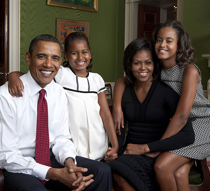 Smiling Barack Obama with family in a warm, elegant setting, highlighting marriage harmony. Smiling Barack Obama with family in a warm, elegant setting, highlighting marriage harmony.